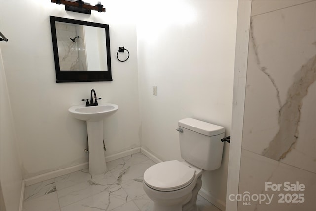 bathroom with toilet and sink