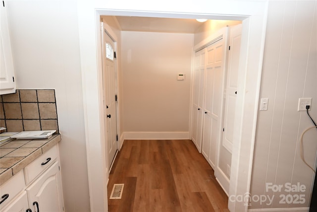 hallway featuring light hardwood / wood-style flooring