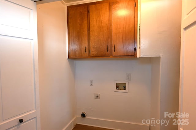 laundry room featuring cabinets, hookup for a washing machine, and hookup for an electric dryer