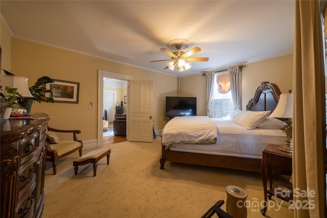 bedroom with ceiling fan, light colored carpet, and ornamental molding