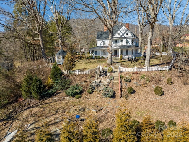 rear view of house with covered porch