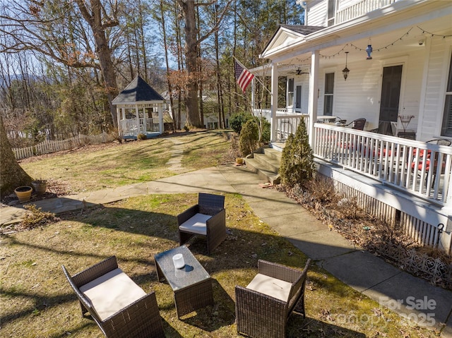 view of yard featuring covered porch