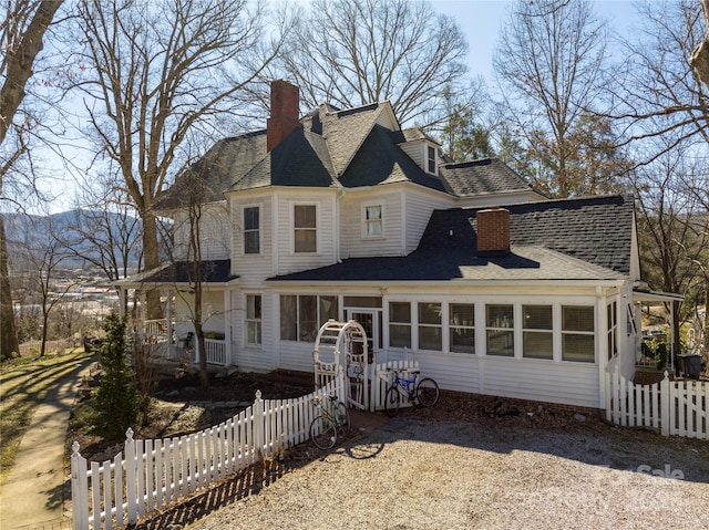 view of front of home with a sunroom