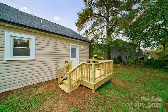 wooden deck with a lawn