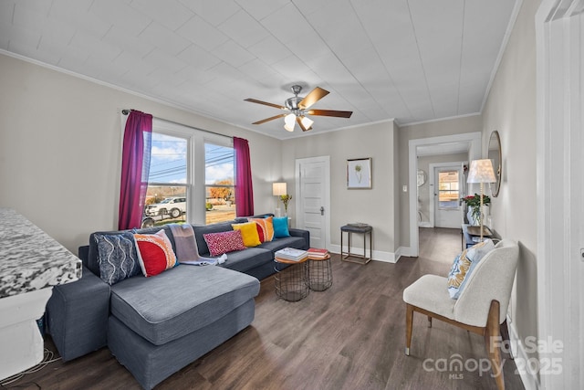 living room featuring ceiling fan, dark hardwood / wood-style flooring, and ornamental molding