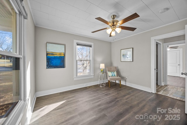 unfurnished room featuring ceiling fan, dark hardwood / wood-style floors, and crown molding