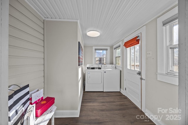 laundry area with washer and dryer, plenty of natural light, ornamental molding, and dark wood-type flooring