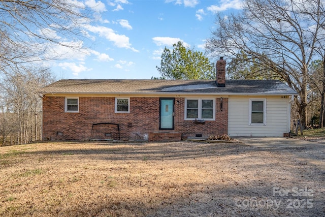 back of house with a yard