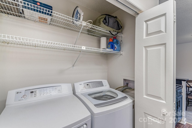 laundry area with washer and dryer and laundry area