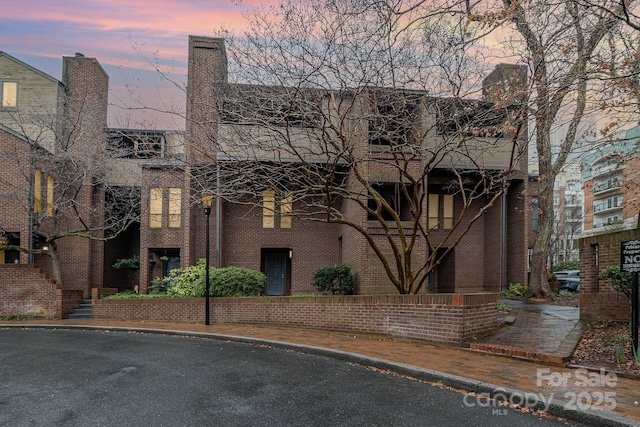 view of property at dusk