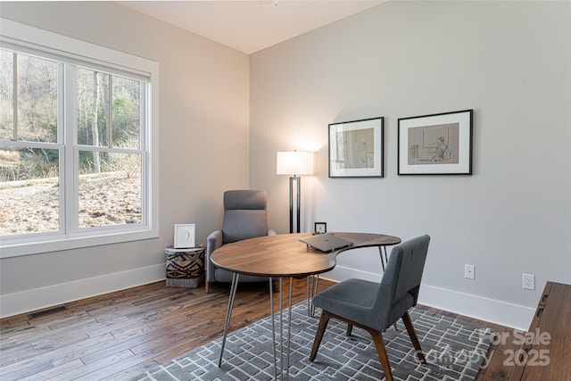 home office with hardwood / wood-style flooring