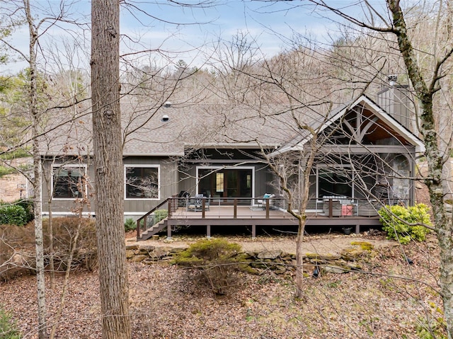 rear view of house with a deck