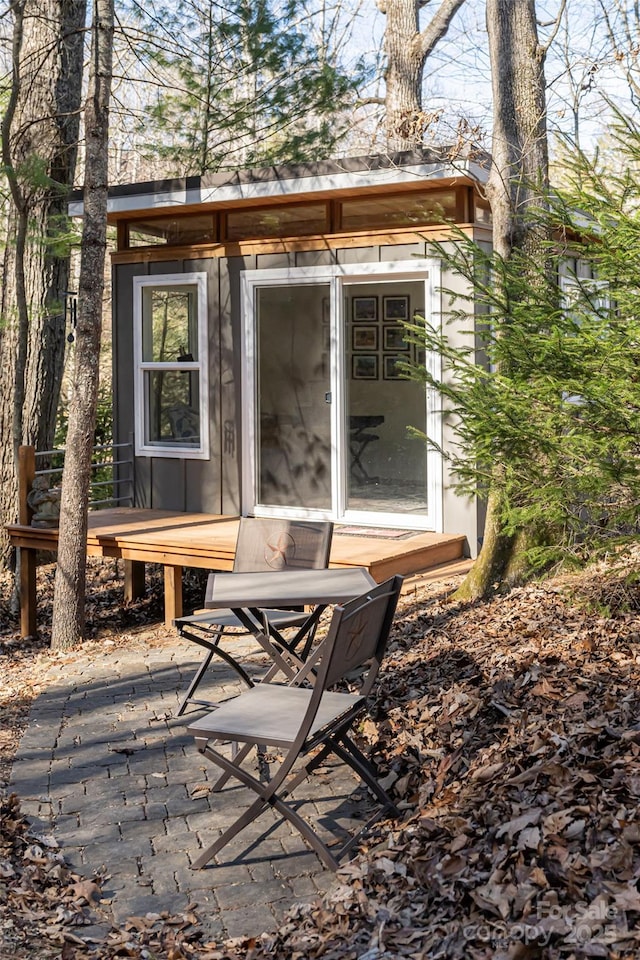 view of patio / terrace featuring an outbuilding