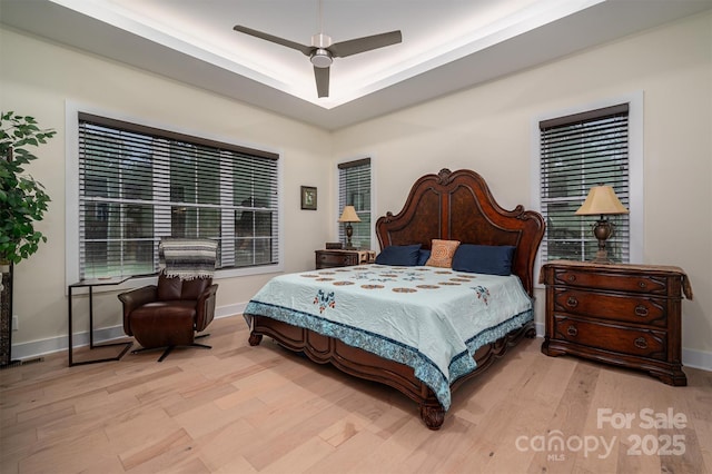 bedroom featuring light hardwood / wood-style floors and ceiling fan