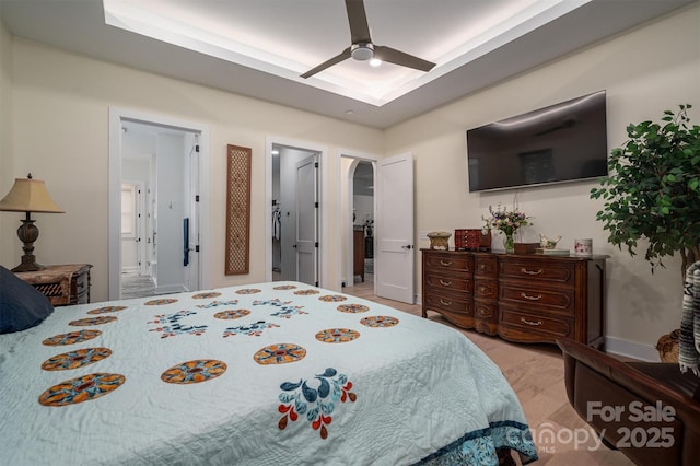 bedroom featuring ensuite bathroom and ceiling fan