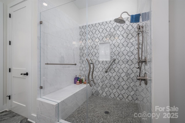 bathroom featuring tiled shower