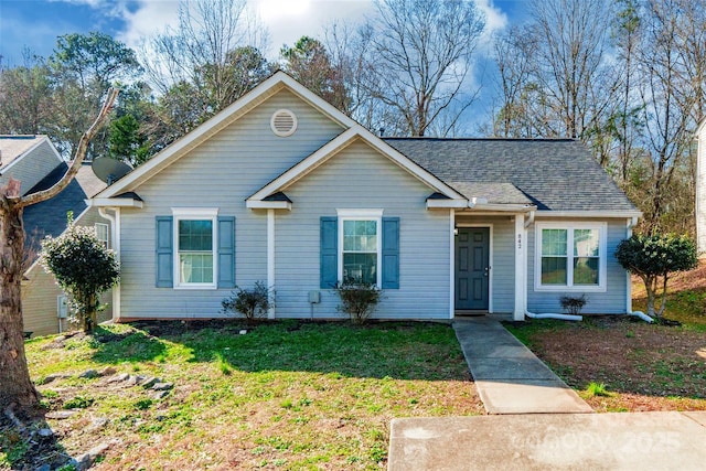 view of front of home with a front lawn