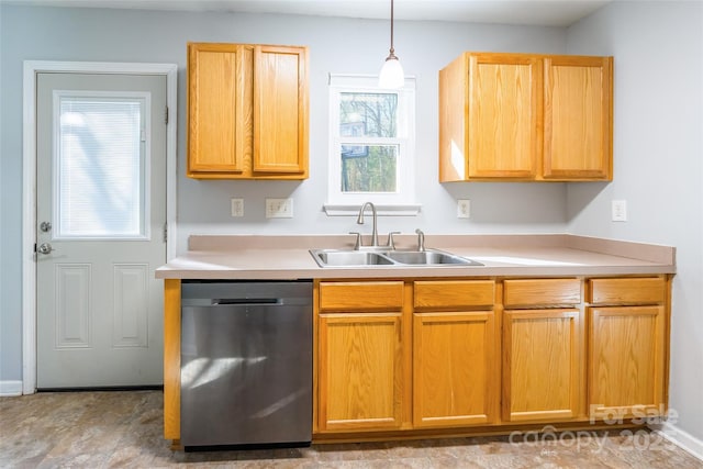 kitchen with sink, stainless steel dishwasher, and decorative light fixtures