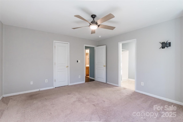 unfurnished bedroom with ceiling fan and carpet