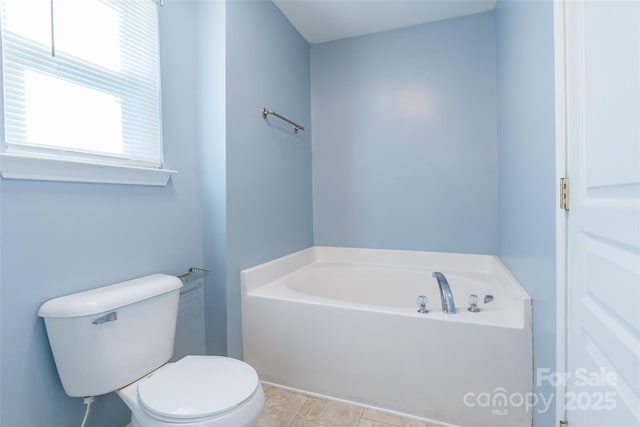 bathroom with toilet and a bathtub