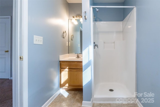 bathroom with a shower and vanity