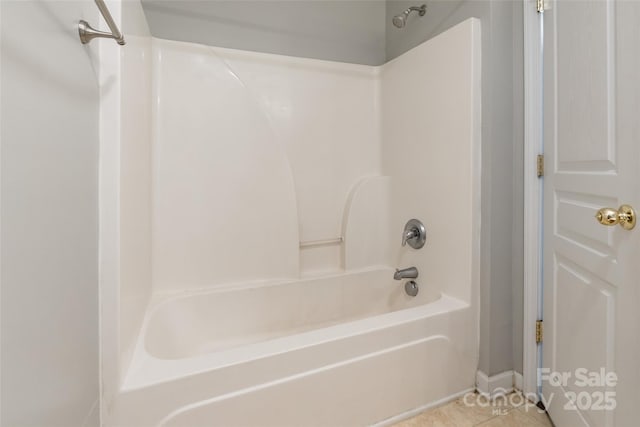 bathroom with tile patterned flooring and shower / tub combination