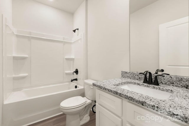 full bathroom featuring shower / bathing tub combination, vanity, toilet, and hardwood / wood-style floors