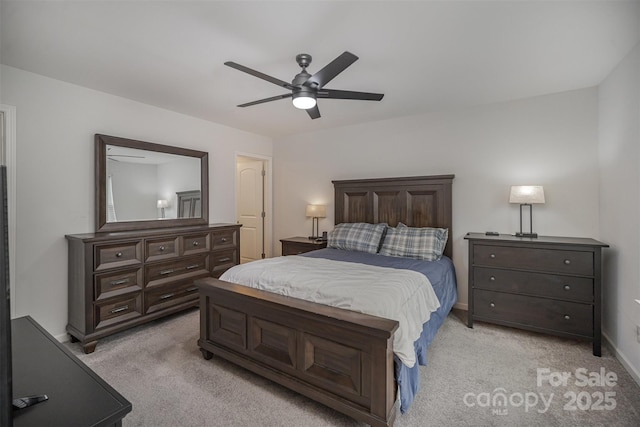 bedroom featuring light carpet and ceiling fan