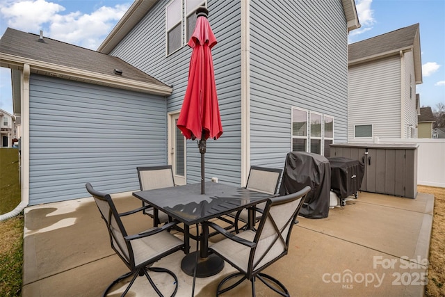 view of patio featuring a grill