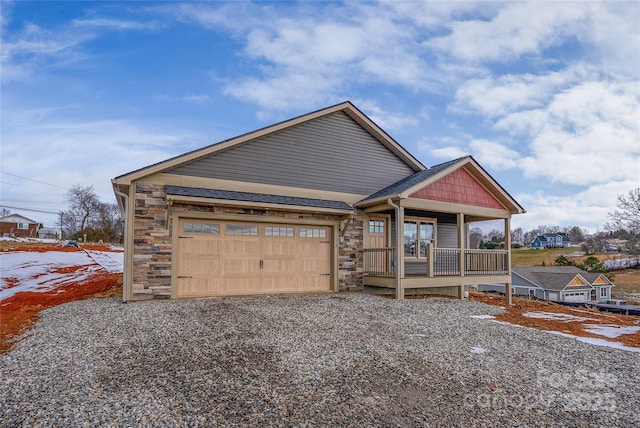 view of front of house featuring covered porch and a garage