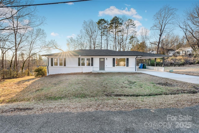 single story home with a front yard and a carport