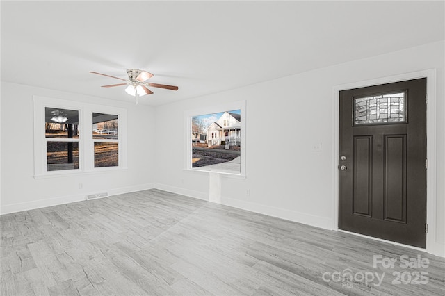 foyer featuring ceiling fan and light wood-type flooring