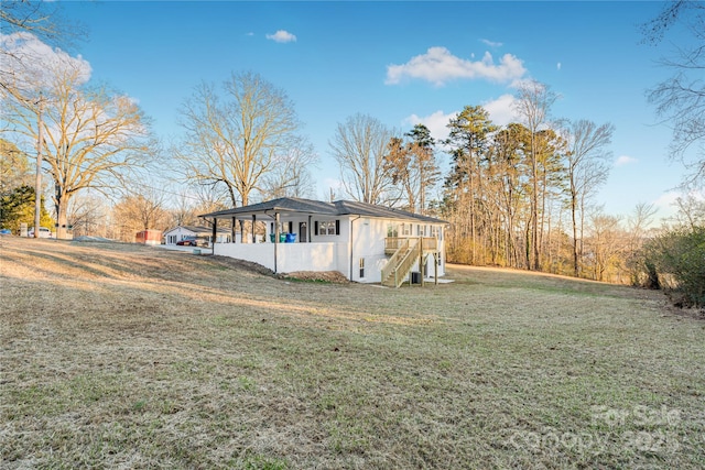 view of property exterior with a lawn