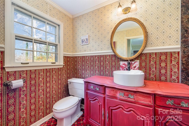 bathroom with crown molding, vanity, and toilet