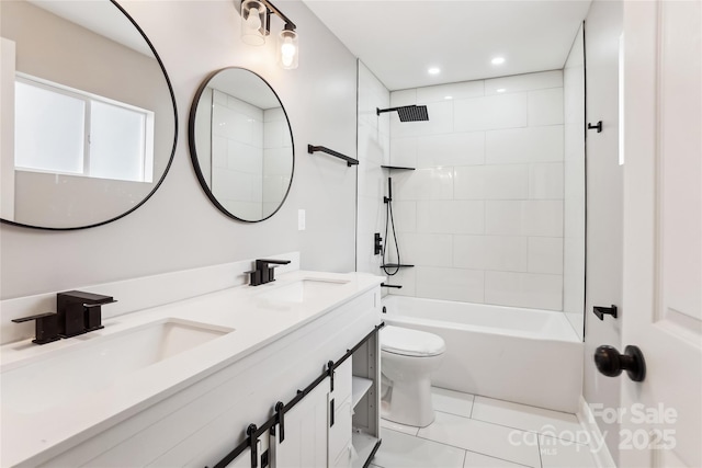 full bathroom featuring vanity, tile patterned flooring, tiled shower / bath combo, and toilet