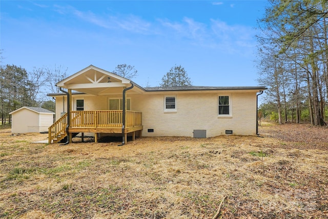 back of property with a wooden deck