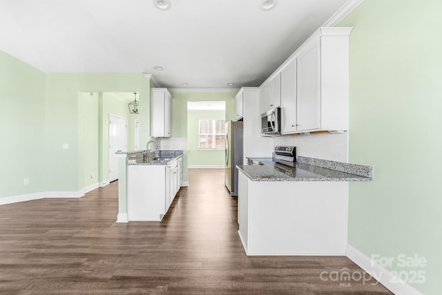 kitchen featuring sink, stone countertops, white cabinets, and stainless steel appliances