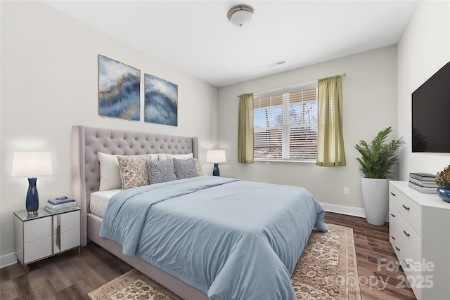 bedroom featuring dark hardwood / wood-style floors