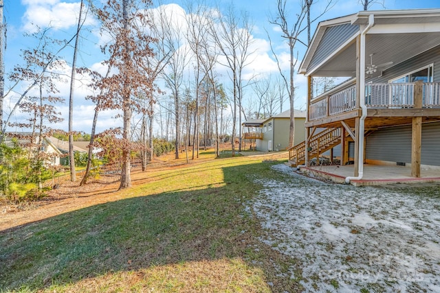 view of yard with a patio area and a wooden deck