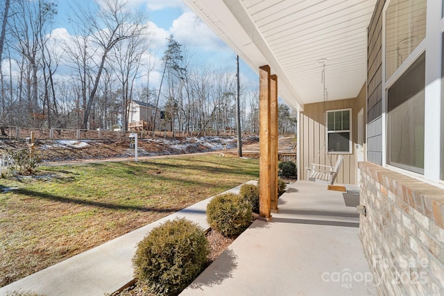 view of yard with covered porch