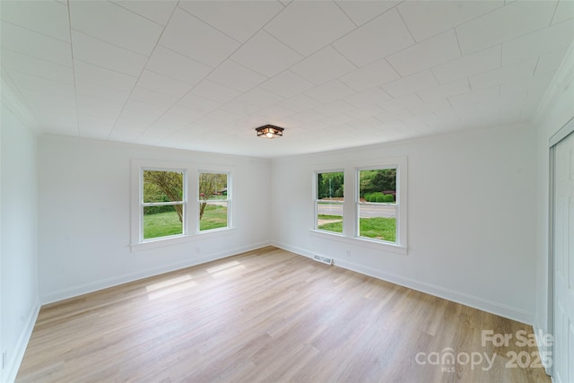 unfurnished room with light hardwood / wood-style flooring