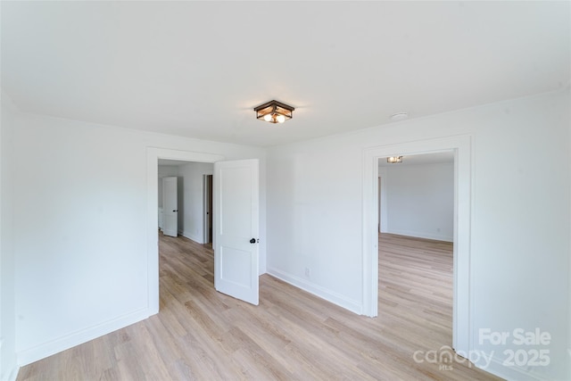 unfurnished room with light hardwood / wood-style flooring