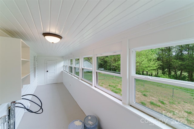 unfurnished sunroom with wooden ceiling