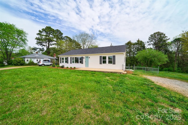 ranch-style home with a front yard