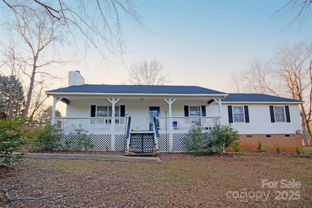 ranch-style home featuring a porch