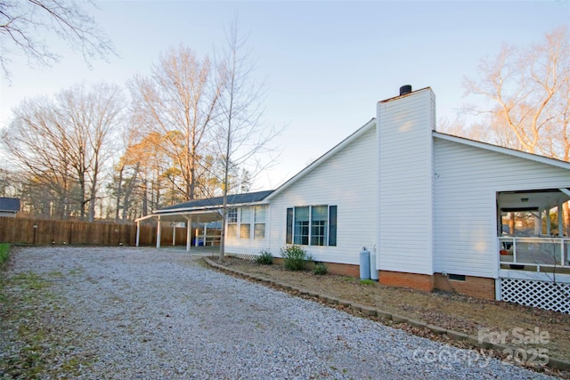 rear view of house with a carport