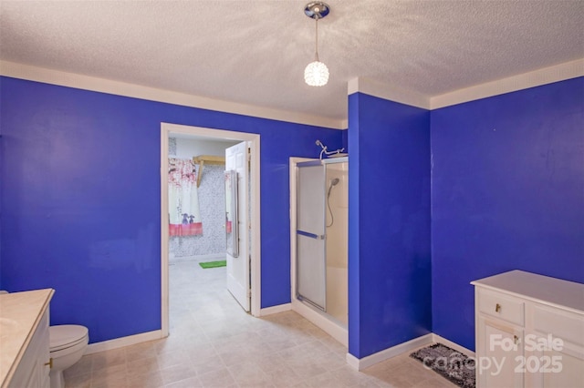 bathroom featuring toilet, a shower, and vanity