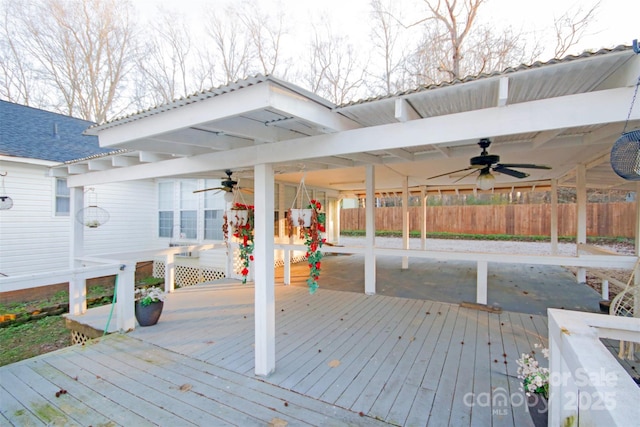 wooden terrace featuring ceiling fan