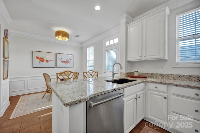 kitchen with white cabinets, dishwasher, kitchen peninsula, and sink