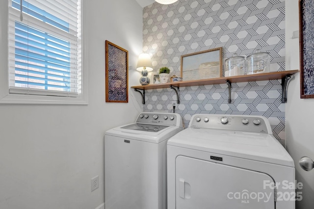 laundry area with independent washer and dryer